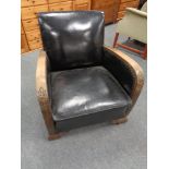 A wood framed Art Deco armchair upholstered in a black vinyl