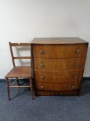 An Edwardian bedroom chair together with a mid 20th century walnut bow fronted four drawer chest