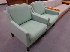 A pair of 20th century armchairs upholstered in a green fabric