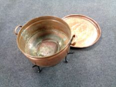 A 19th century copper twin handled log bin on cast iron stand together with a further antique