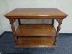 A 19th century oak three tier serving stand