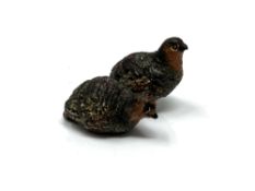A small cold-painted bronze figure of two quails in the manner of Bergmann