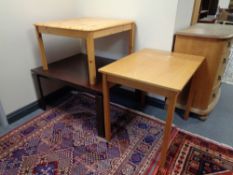 A pine square coffee table together with a further square coffee table and a two seater dining