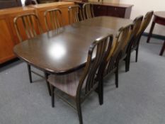 A 20th century Danish Farstrup twin pedestal extending dining table with two leaves together with a