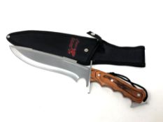 A Frost USA hunting knife in sheath