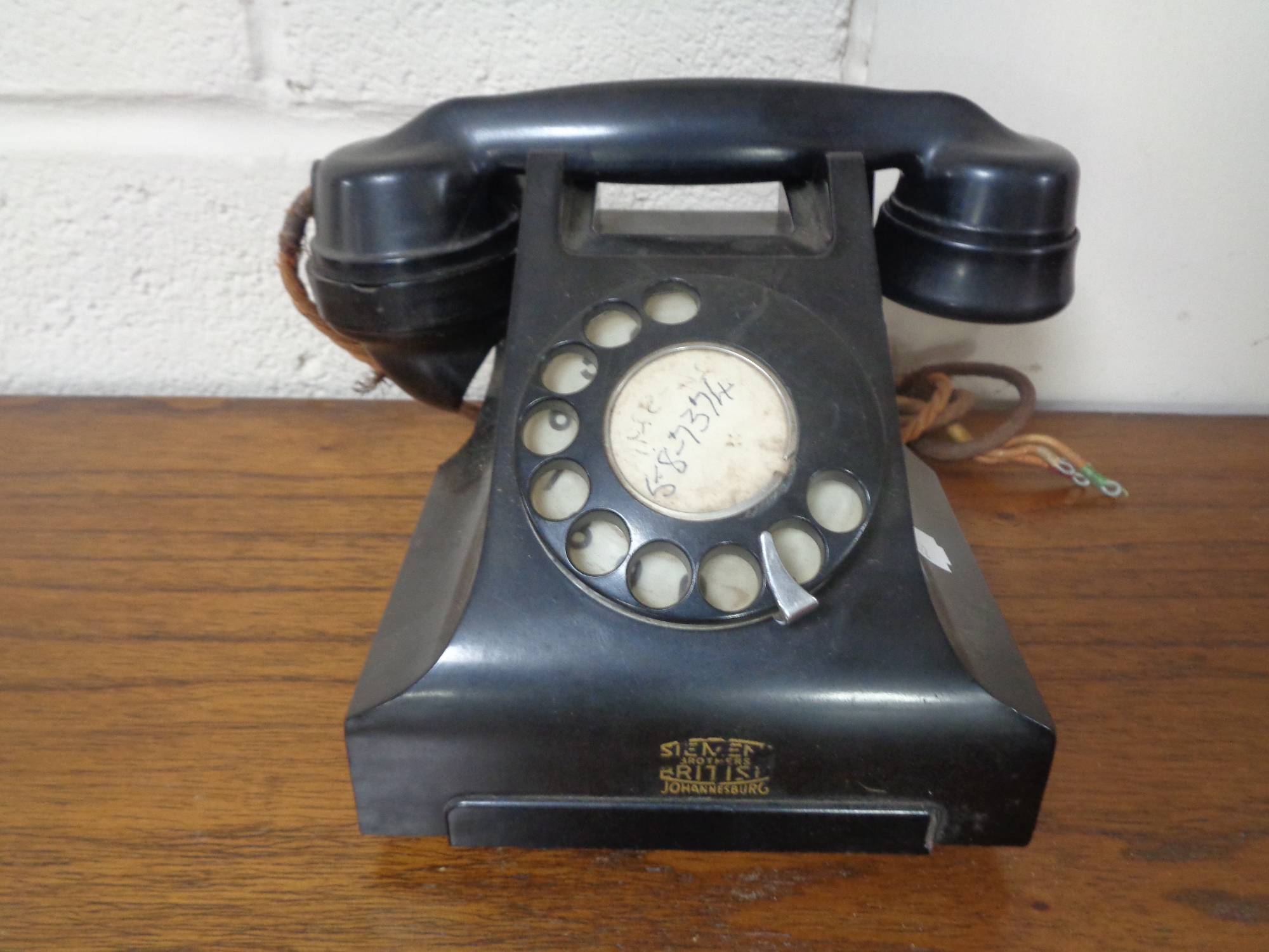 A black Bakelite cased telephone
