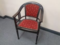 A 20th century ebonised beech armchair