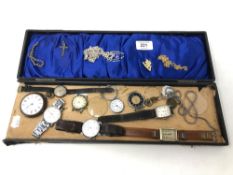 A collection of wristwatches and watch faces, chains,