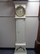An early 20th century painted cased longcase clock with circular dial