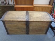A 19th century oak metal bound dome topped shipping trunk