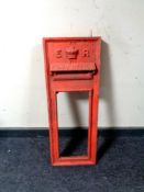 A cast iron ER postbox front