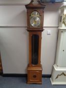 An Artime Tempus Fugit longcase clock with pendulum and weights