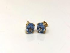 A pair of 18ct yellow gold aquamarine earrings, head measurements 6.95 mm x 7.03 mm.