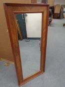 An antique walnut framed hall mirror