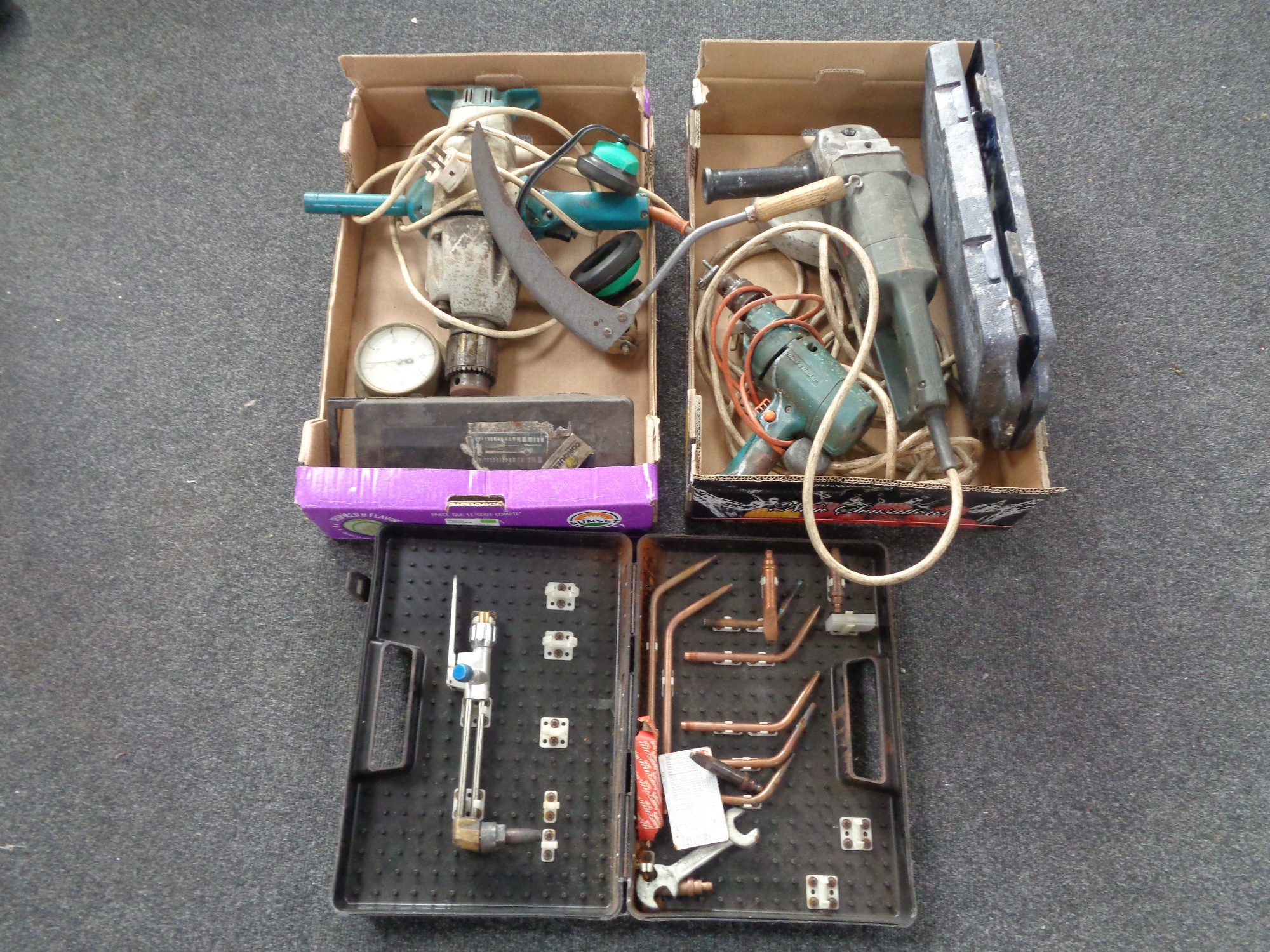 Two boxes containing assorted electricals, cased socket set, hand scythe,