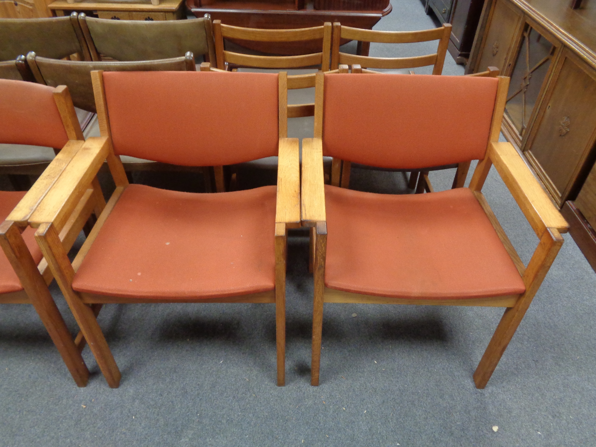 A set of four 20th century Danish armchairs upholstered in a red corded fabric