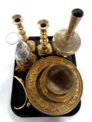 A tray containing assorted antique and later brass wares to include brass candlesticks,