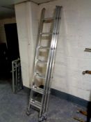 A Youngman triple extension aluminium ladder