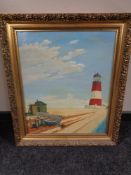 A James Holland oil on canvas depicting rowing boats on a beach with lighthouse beyond,