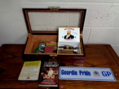 A counter top humidor containing cigars,