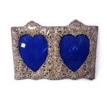 A 20th century silver embossed double heart shaped photo frame