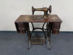 A 20th century Singer treadle sewing machine in table