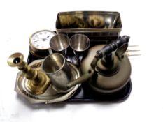 A tray of metal wares - brass ship's style clock, copper kettle, brass toasting fork,