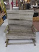 A Pepe wooden slatted garden rocking bench