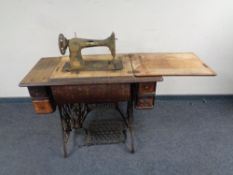 A 20th century Singer treadle sewing machine in table