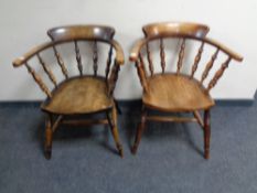A pair of Edwardian beech smoker's armchairs