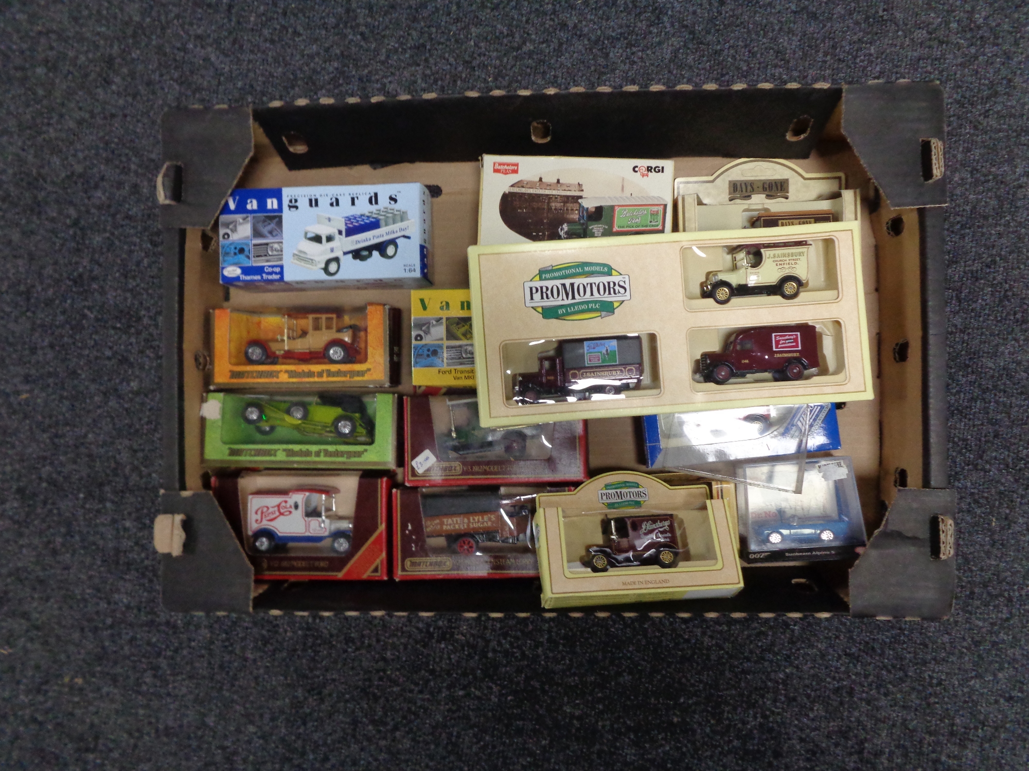 A box containing boxed die cast vehicles to include Matchbox models of yesteryear,
