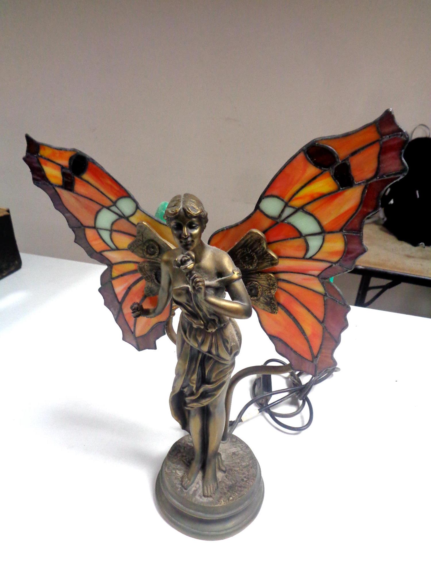 An Art Deco style figural table lamp of a lady with leaded glass wings