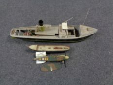 Two part built wooden model boats together with a part built spitfire