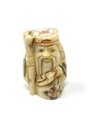 A carved Chinese bone netsuke - Elderly Gentleman with staff