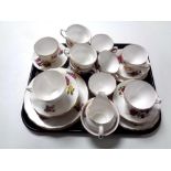 A tray of two part Colclough and Royal Vale bone china tea services