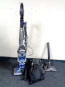 A Shark upright vacuum cleaner and accessories