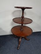 A Chapman's Siesta three tier circular dumb waiter on tripod stand