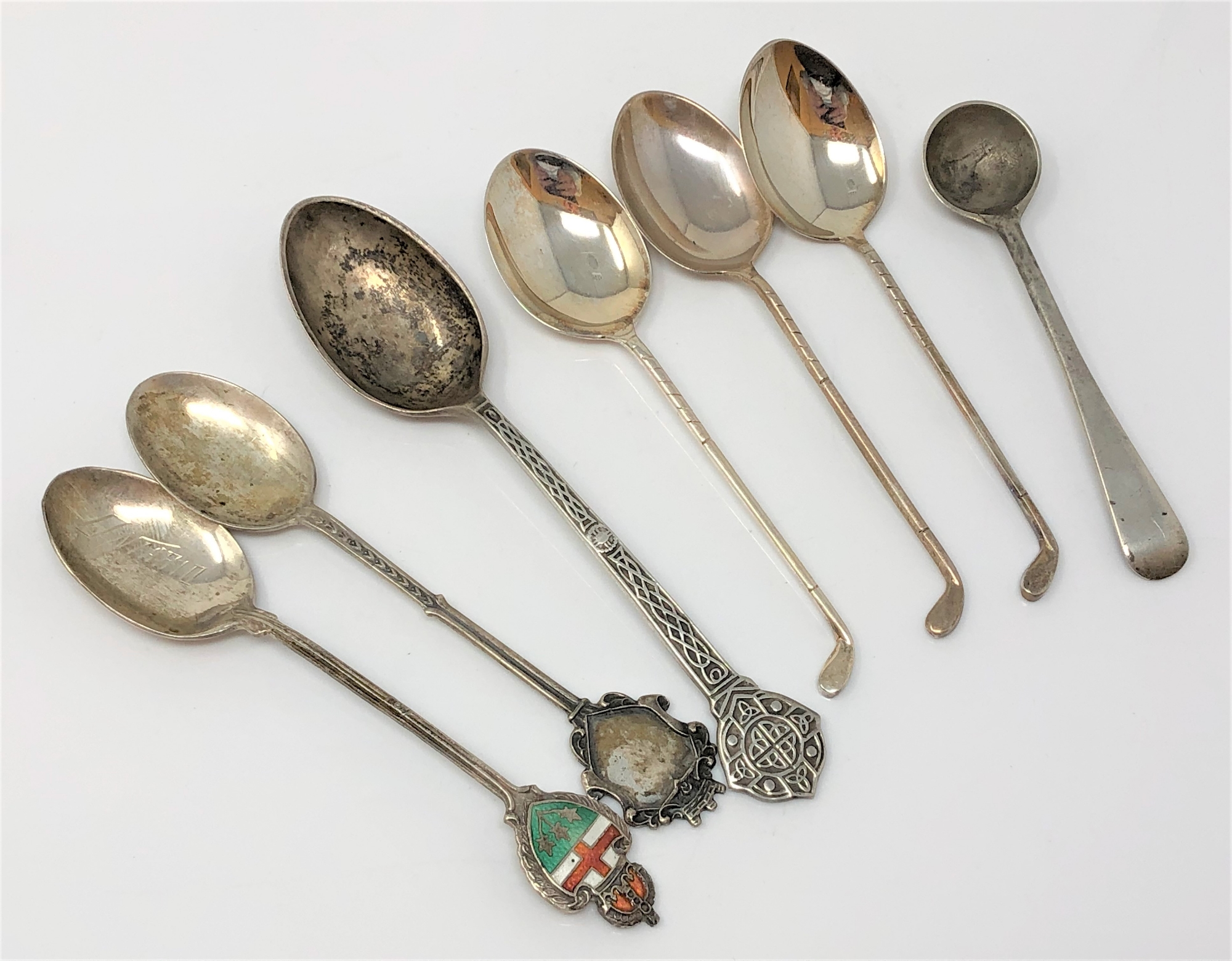 A group of silver spoons,