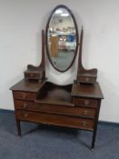 A late Victorian inlaid mahogany sunk centre dressing table with mirror