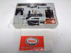 A boxed Mamod live steam locomotive kit,