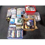 Seven boxes containing a quantity of assorted DVDs