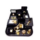 A tray of a quantity of boxed and unboxed brass collectable timepieces