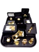 A tray of a quantity of boxed and unboxed brass collectable timepieces