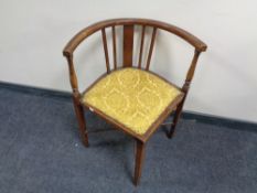 An Edwardian mahogany corner chair