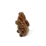 A carved Chinese hardwood netsuke - Rabbit