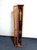 A stick barometer by F Darton & Company Ltd in fitted cabinet