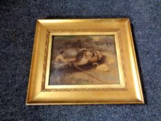 A 19th century gilt framed crystoleum depicting figures in a rowing boat on a river