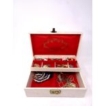 A jewellery box of assorted costume jewellery, beaded necklaces, brooches,