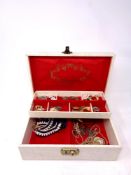 A jewellery box of assorted costume jewellery, beaded necklaces, brooches,