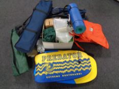 A large quantity of camping equipment to include tent in bag, camp beds, beach shelter,